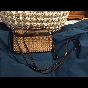 Clutch purse with shoulder strap and wrist strap